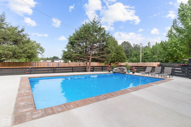 view of swimming pool with a fenced backyard, a fenced in pool, and a patio area