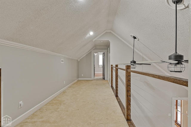 2203 Rankin Cir, Jonesboro, AR 72404 - bonus room with a textured ceiling, lofted ceiling, ceiling fan, light colored carpet, and baseboards