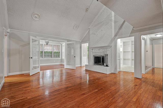 2203 Rankin Cir, Jonesboro, AR 72404 - unfurnished living room featuring a textured ceiling, ornamental molding, a fireplace, baseboards, and wood finished floors