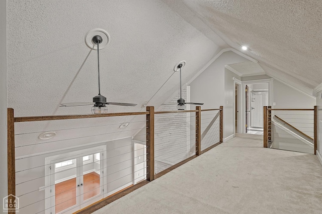 2203 Rankin Cir, Jonesboro, AR 72404 - corridor featuring a textured ceiling, an upstairs landing, lofted ceiling, and carpet floors