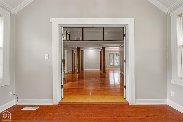2203 Rankin Cir, Jonesboro, AR 72404 - corridor with ornamental molding, wood finished floors, baseboards, and vaulted ceiling