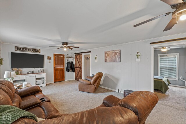 215 N Nance St, Monette, AR 72447 - carpeted living room featuring a ceiling fan, crown molding, and a barn door