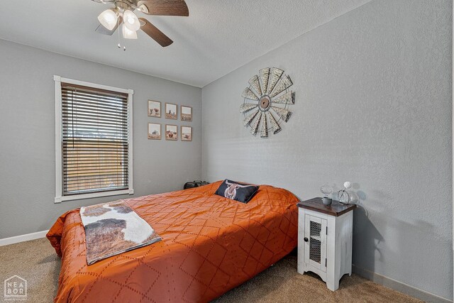 215 N Nance St, Monette, AR 72447 - bedroom featuring carpet floors, baseboards, and a ceiling fan