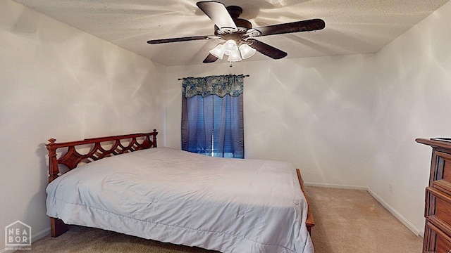 2316 Sheffield Dr, Jonesboro, AR 72405 - bedroom with carpet flooring, baseboards, a ceiling fan, and a textured ceiling