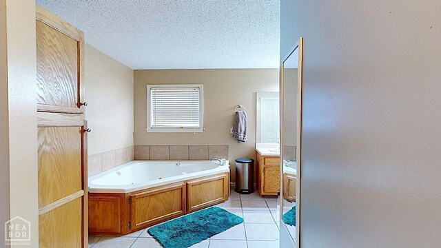 2316 Sheffield Dr, Jonesboro, AR 72405 - full bath featuring vanity, a jetted tub, tile patterned floors, and a textured ceiling