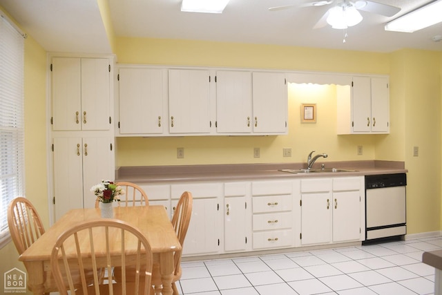 kitchen with light countertops, white cabinetry, ceiling fan, white dishwasher, and a sink