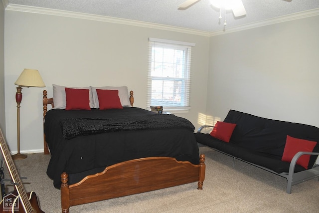 carpeted bedroom featuring a textured ceiling, ornamental molding, and ceiling fan