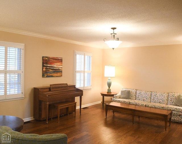 living room with a healthy amount of sunlight, ornamental molding, baseboards, and dark wood finished floors