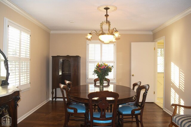 dining area with baseboards, ornamental molding, and dark wood finished floors