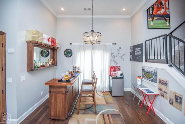 dining space with stairs, baseboards, ornamental molding, and wood finished floors