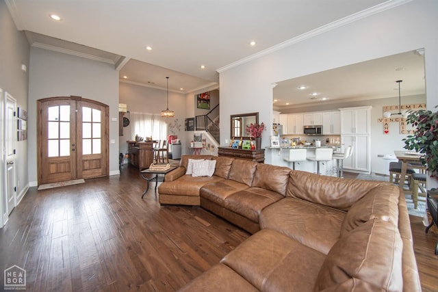 living room featuring recessed lighting, stairs, and dark wood-style floors