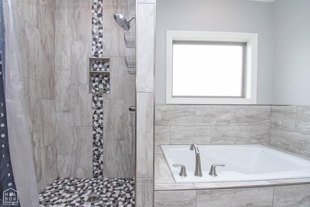 full bath featuring a garden tub and a tile shower