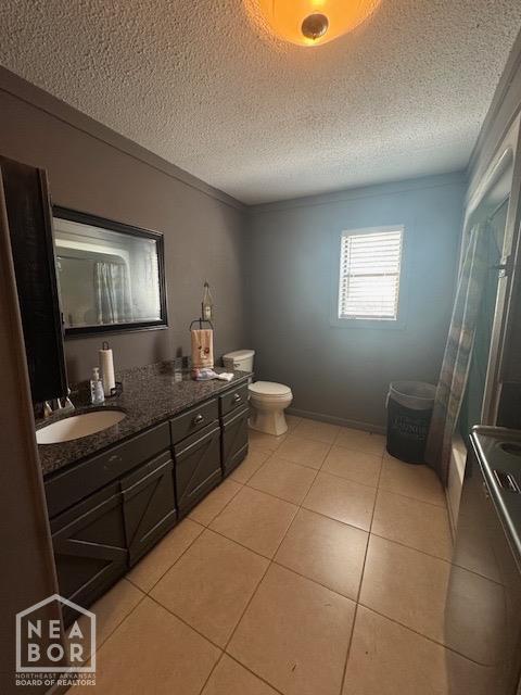 full bathroom featuring vanity, crown molding, tile patterned flooring, and a textured ceiling
