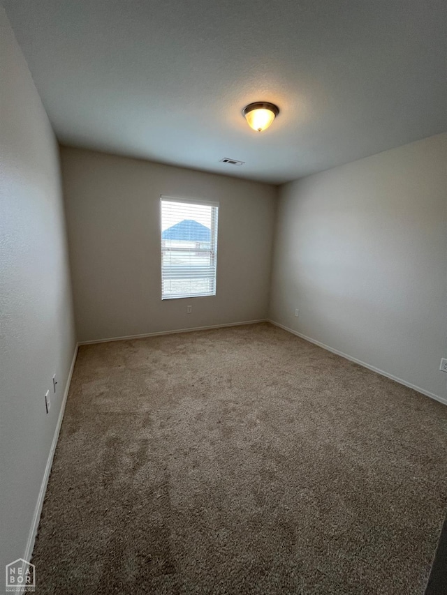 3828 Remington Dr, Jonesboro, AR 72404 - unfurnished room featuring baseboards, visible vents, and carpet floors