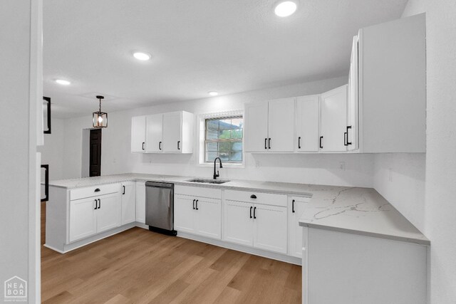 kitchen with dishwasher, a sink, white cabinets, light wood-style floors, and recessed lighting