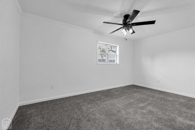 spare room with crown molding, baseboards, and dark colored carpet