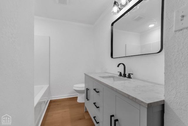 full bathroom with vanity, ornamental molding, visible vents, wood finished floors, and toilet