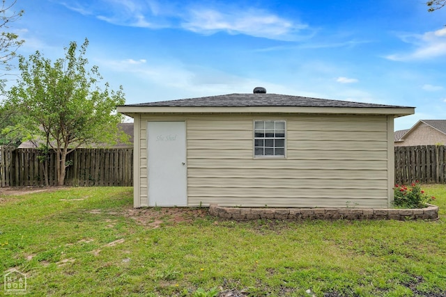 view of outbuilding featuring a fenced backyard and an outbuilding
