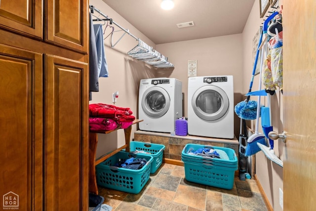 330 Greene 730th Rd, Paragould, AR 72450 - laundry area featuring washing machine and clothes dryer and stone finish floors