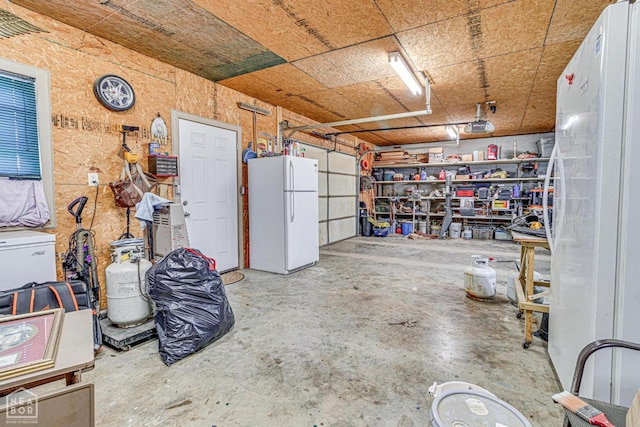 330 Greene 730th Rd, Paragould, AR 72450 - garage with freestanding refrigerator and a garage door opener