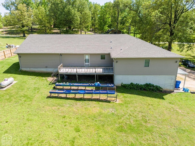 330 Greene 730th Rd, Paragould, AR 72450 - rear view of property with a trampoline and a wooden deck