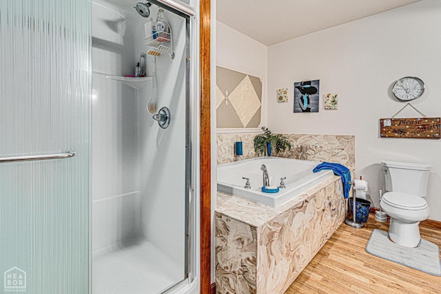 330 Greene 730th Rd, Paragould, AR 72450 - bathroom with a shower stall, a garden tub, and wood finished floors