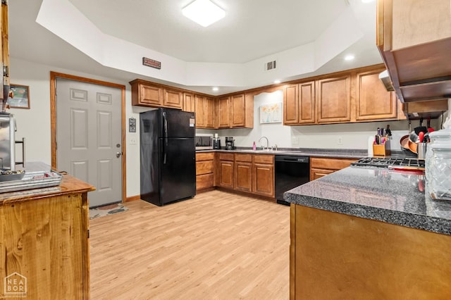 330 Greene 730th Rd, Paragould, AR 72450 - kitchen featuring black appliances, light wood-type flooring, brown cabinetry, and recessed lighting