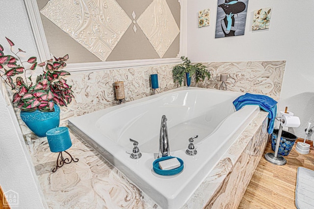 330 Greene 730th Rd, Paragould, AR 72450 - bathroom with a garden tub and wood finished floors