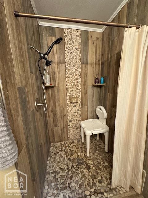 1207 Basil St, Corning, AR 72422 - full bath featuring tiled shower, ornamental molding, and wooden walls