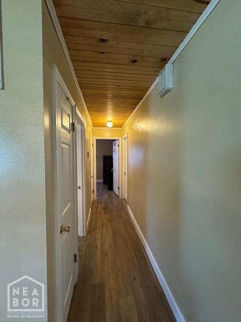 1207 Basil St, Corning, AR 72422 - hallway featuring wood ceiling, wood finished floors, and crown molding