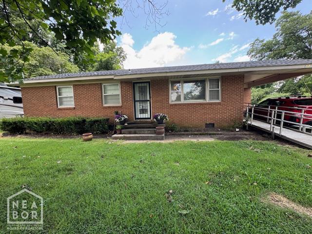 1207 Basil St, Corning, AR 72422 - ranch-style house with brick siding, a front lawn, and crawl space