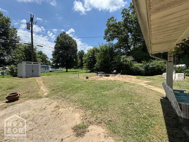 1207 Basil St, Corning, AR 72422 - view of green lawn with a storage shed