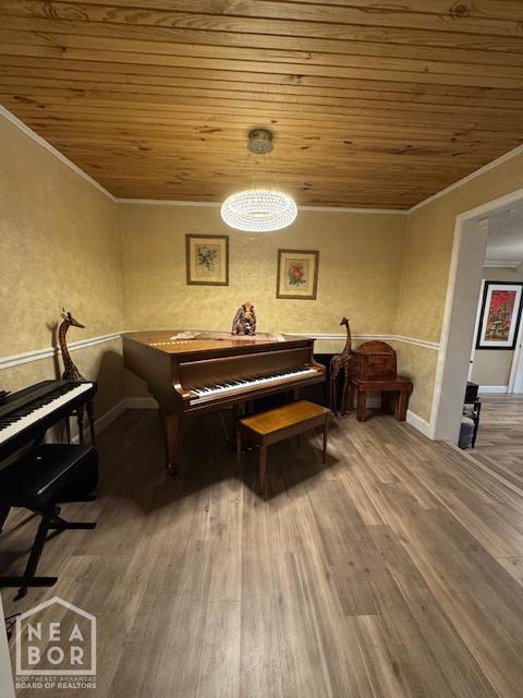 1207 Basil St, Corning, AR 72422 - sitting room featuring ornamental molding, wooden ceiling, and wood finished floors