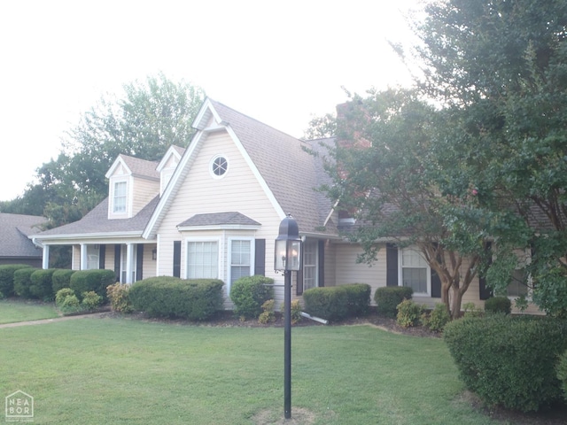 1201 Nancy Ave, Newport, AR 72112 - view of front of house featuring a front yard and roof with shingles