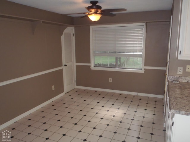 1201 Nancy Ave, Newport, AR 72112 - spare room with a ceiling fan, light flooring, and arched walkways