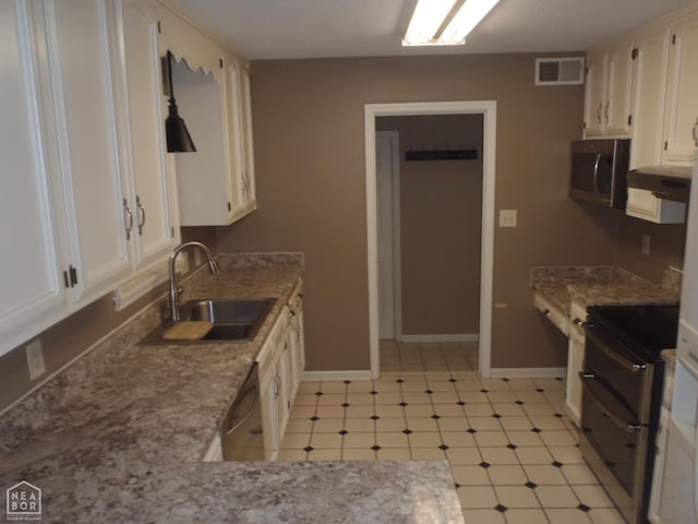 1201 Nancy Ave, Newport, AR 72112 - kitchen featuring stainless steel appliances, light flooring, white cabinets, and light stone countertops
