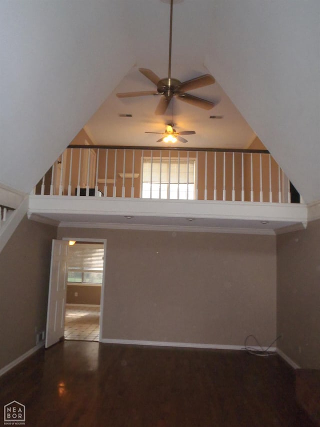 1201 Nancy Ave, Newport, AR 72112 - staircase featuring a ceiling fan, a high ceiling, and wood finished floors