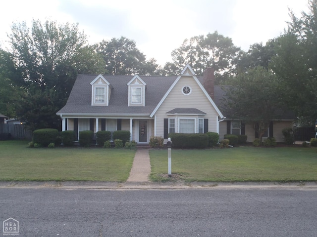 1201 Nancy Ave, Newport, AR 72112 - view of front of house with a front yard and a chimney