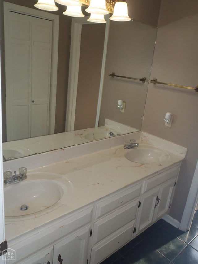 1201 Nancy Ave, Newport, AR 72112 - bathroom with double vanity and tile patterned floors