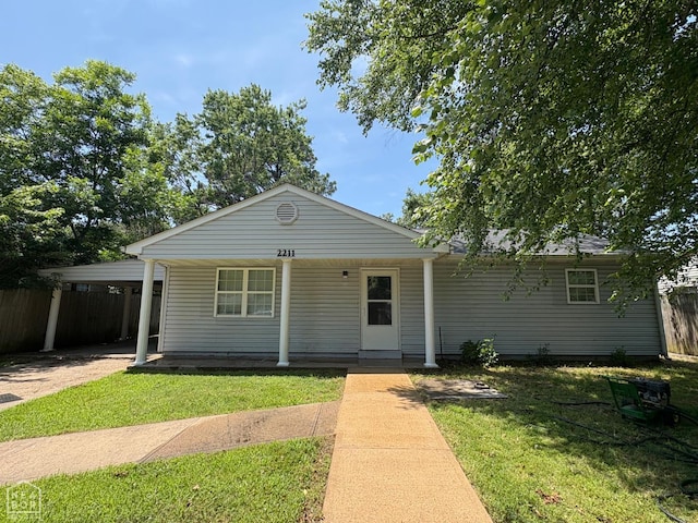 2211 Sutton Dr, Jonesboro, AR 72401 - view of front of house with a carport and covered porch