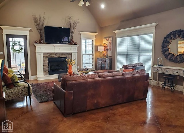 2301 Westminster Way, Jonesboro, AR 72401 - living room with a stone fireplace, ceiling fan, finished concrete flooring, and high vaulted ceiling