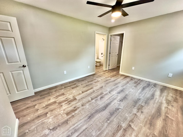 377 N 3rd St, Black Rock, AR 72415 - unfurnished bedroom featuring wood finished floors, connected bathroom, and ceiling fan