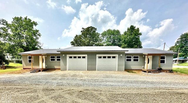 377 N 3rd St, Black Rock, AR 72415 - view of front of home featuring driveway, a garage, a metal roof, and board and batten siding