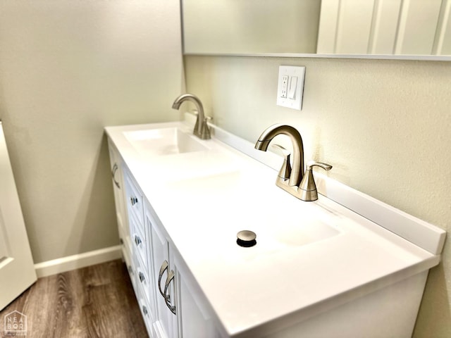 377 N 3rd St, Black Rock, AR 72415 - bathroom with double vanity and wood finished floors