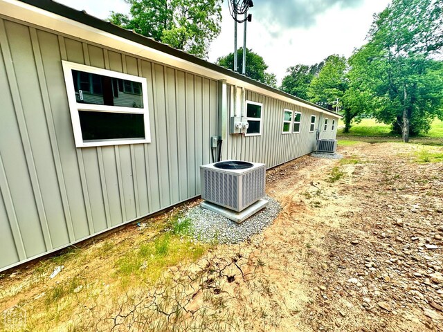 377 N 3rd St, Black Rock, AR 72415 - view of home's exterior with board and batten siding and a central AC unit