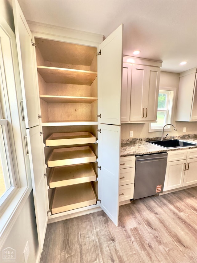 377 N 3rd St, Black Rock, AR 72415 - kitchen with stainless steel dishwasher, light wood-type flooring, recessed lighting, white cabinetry, and open shelves