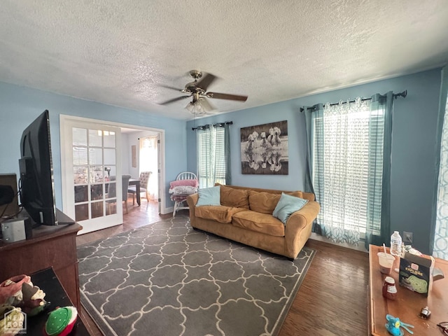 715 S 5th Ave, Paragould, AR 72450 - living area with a textured ceiling, wood finished floors, and ceiling fan