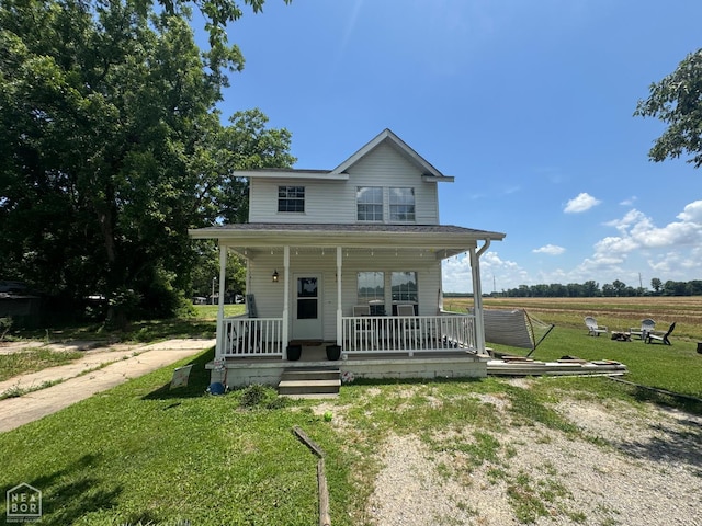 715 S 5th Ave, Paragould, AR 72450 - view of front of property with a porch and a front yard