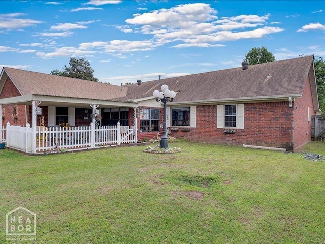 110 Flossie St, Trumann, AR 72472 - rear view of house featuring brick siding and roof with shingles
