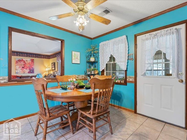 110 Flossie St, Trumann, AR 72472 - tiled dining room featuring baseboards, ornamental molding, and ceiling fan
